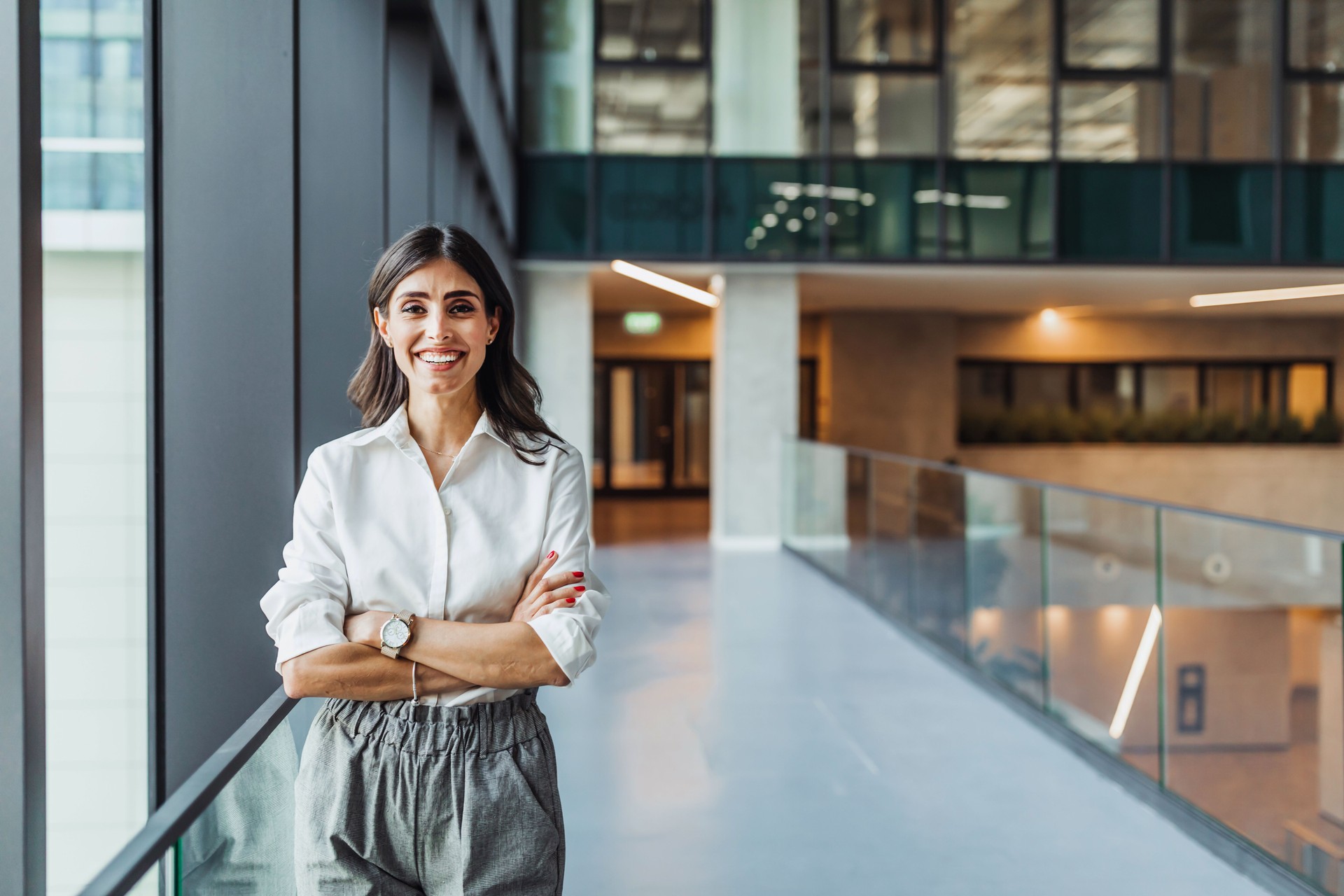 Happy Pretty Mid Adult Business Woman Standing in Hall